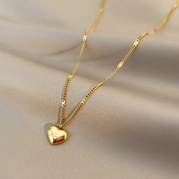 Golden necklace with heart pendant